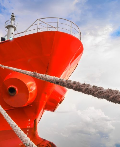 low-angle-view-of-cargo-ship-docked-at-port-with-m-2025-03-11-01-34-37-utc (1) Prime Shipping Agency